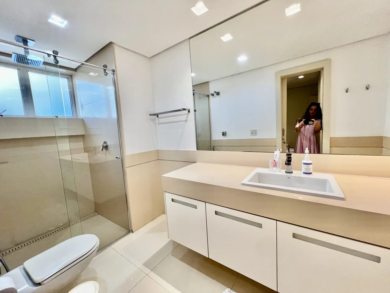 Bathroom with double vanity and glass shower